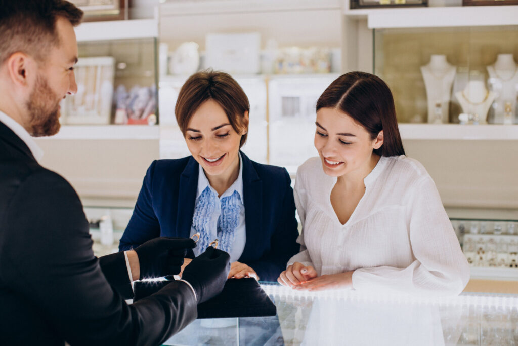 couple at jewelry store choosing a ring together
